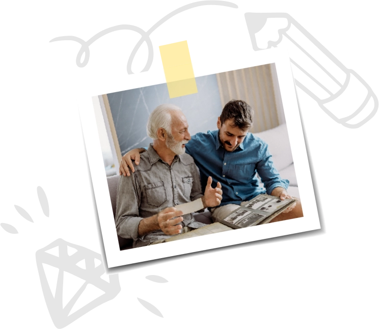 father and son looking at photo album